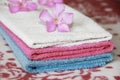 Multi-colored cotton white blue pink bath towels for the bathroom Royalty Free Stock Photo