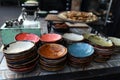 Multi-colored country-style faience plates for snacks, prepared for table setting Royalty Free Stock Photo