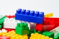 Multi-colored cubes constructor blocks on a white background with copy space from the top. Child education and development concept Royalty Free Stock Photo