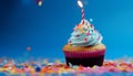 Multi colored cupcake with vibrant icing and confetti decoration generated by AI Royalty Free Stock Photo