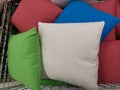 Multi colored decorative pillows in a basket