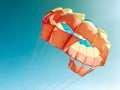 A multi-colored dome of a parachute in the sky as a background Royalty Free Stock Photo