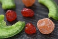 multi-colored dried fruits cherry pomelo on a dark background Royalty Free Stock Photo