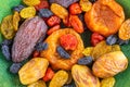 Multi-colored dried fruits on a green background Royalty Free Stock Photo