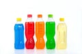 Multi colored drinks in plastic bottles on white background Royalty Free Stock Photo