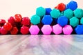 Multi-colored dumbbells lie on the floor in the gym, background, copy space