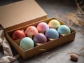 8 multi-colored Easter eggs in a cardboard box made of craft paper. Speckled paint, handmade. Gift idea