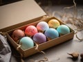 8 multi-colored Easter eggs in a cardboard box made of craft paper. Speckled paint, handmade. Gift idea Royalty Free Stock Photo