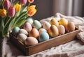 Multi-colored eggs for Easter. Tulips symbol of spring Royalty Free Stock Photo