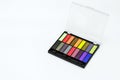 Multi-colored eye shadow palette. Bright colors and shades in cosmetics. Minimalism cosmetic concept.