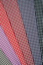 Multi-colored fabric patterns with geometric pattern for sewing.