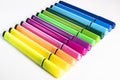 Multi-colored felt-tip pens on a white background. Tools for drawing and creativity. Bright colors. School supplies. opy space Royalty Free Stock Photo