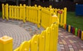 multi-colored fence of children`s attractions