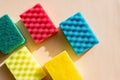 Multi-colored foam rubber sponge for cleaning and washing dishes on a white background. top view, pattern. flat lay Royalty Free Stock Photo