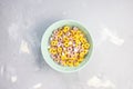 Multi colored fruit loops in a bowl Royalty Free Stock Photo