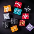 Multi-colored gift boxes with black background Gift boxes prepared Royalty Free Stock Photo