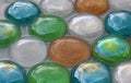 Multi colored glass stones lying in water