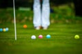 Multi-colored golf balls on green grass. Golf Club. Sports and recreation Royalty Free Stock Photo