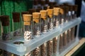 Multi-colored granules of micronutrient fertilizer in test tubes in a row