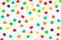 Multi-colored hearts-shaped jelly candies in sugar on a white background. Valentine`s Day. Dessert. Copy space.