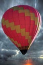 Multi colored hot air balloon fly in the blue sky Royalty Free Stock Photo