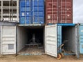 Multi-colored iron industrial sea containers for international transportation of goods according to the logistic rules of Royalty Free Stock Photo