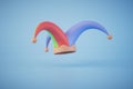 a multi-colored jester hat on a blue background. copy paste, copy space. 3D render