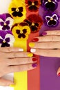 Multi-colored juicy manicure on short female nails Royalty Free Stock Photo