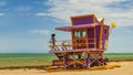 Model poses on a Miami Beach lifeguard station