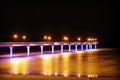 Multi colored lighted bridge at night