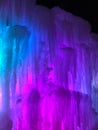 Multi-colored lighted icicle walls in ice castle