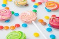 Multi-colored lollipops and sweet jelly beans, on a white background Royalty Free Stock Photo
