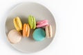 Multi-colored macaroons on a white background. Free space for text.