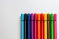 Multi-colored markers on a white background. School Supplies. copyspace for text