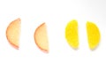 Multi-colored marmalade in the form of slices of lemon and orange on a white back