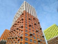 Multi-colored modern multi-storey residential building and multi-apartment panel house with Windows and balconies Royalty Free Stock Photo