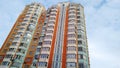 Multi-colored modern multi-storey residential building and multi-apartment panel house with Windows and balconies Royalty Free Stock Photo