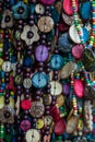 Multi-colored necklaces made of beads and various objects