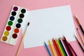 Multi-colored objects for drawing and creativity for children lie on a pink background. Bright watercolor paints, pencils, brushes Royalty Free Stock Photo