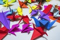 Color paper cranes of origami from paper.Multi-colored origami in the form of cranes on the table. Origami symbol Royalty Free Stock Photo