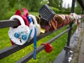 Multi-colored padlocks with keys thrown into the river. Royalty Free Stock Photo