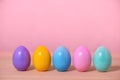 multi colored painted Easter eggs over pink background, fest Royalty Free Stock Photo