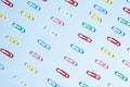 Multi-colored paper clips in row Royalty Free Stock Photo