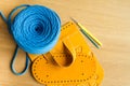 Multi-colored parts, straps, crochet hooks and bright blue yarn for making handmade knitted bags. Selective soft focus Royalty Free Stock Photo