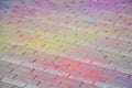 Multi colored paving slabs, powder coated with dry colors at the Holi festival Royalty Free Stock Photo