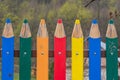 Colorful decorative wooden fence that resembles sharpened crayons or pencils Royalty Free Stock Photo