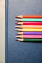 Multi-colored pencils on a blue background Royalty Free Stock Photo