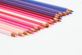 Multi-colored pencils lie on a white table, the violet range of colors Royalty Free Stock Photo