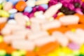 Mixed pills out of focus. Royalty Free Stock Photo