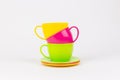 multi-colored plastic cups and plates on a white background kitchen set Royalty Free Stock Photo